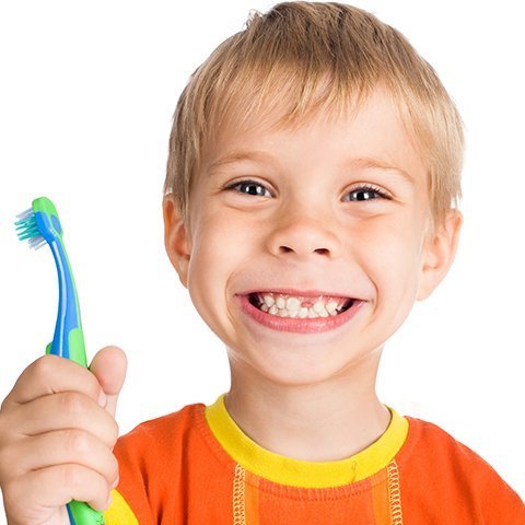 child with toothbrush